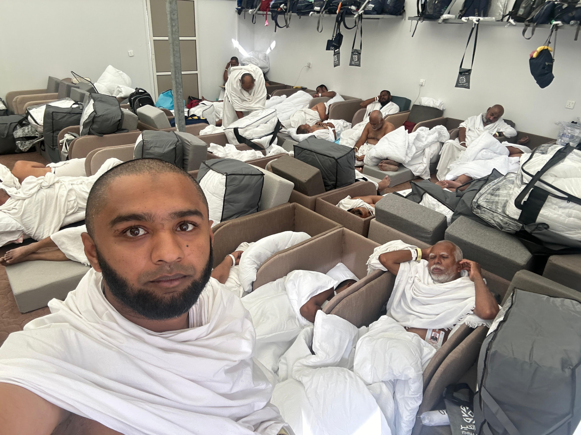Pilgrims resting in the Mina camp during Hajj